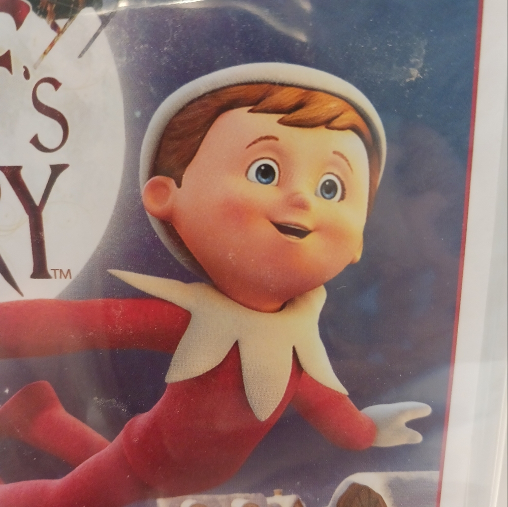An Elf'S Story DVD and a 6in pocket elf christmas nightgown both new read desc